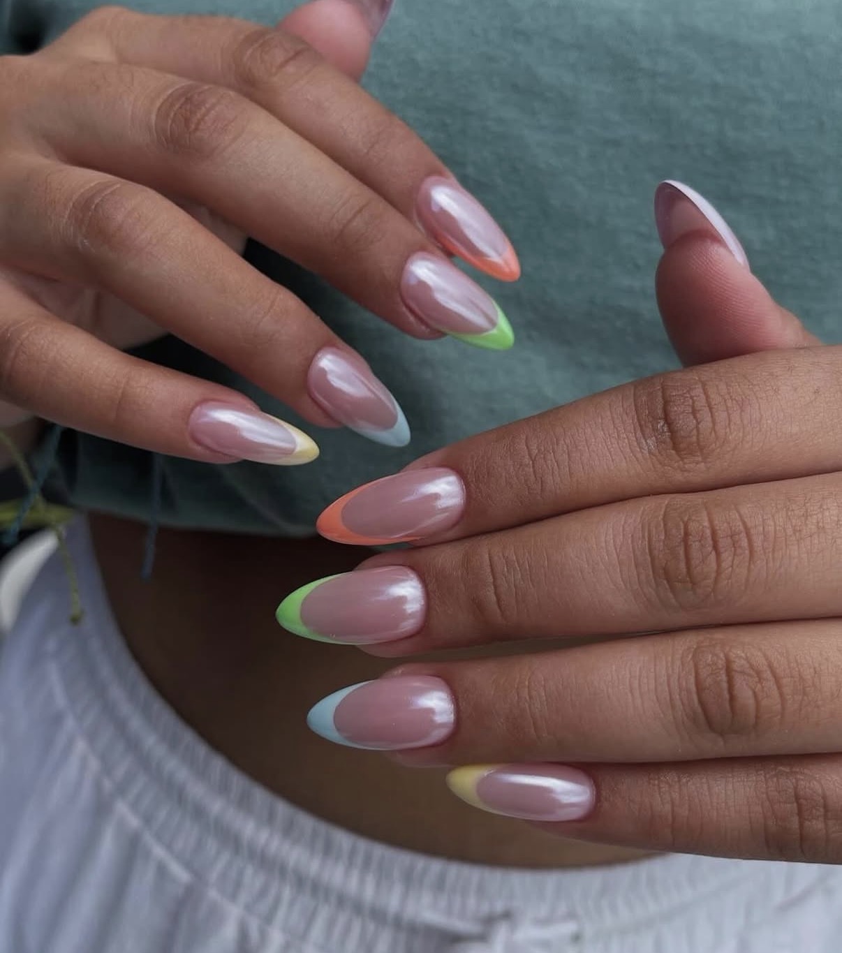 Glazed almond nails with pastel colored French tips