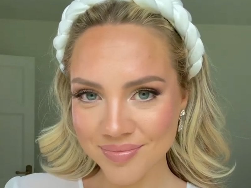 Soft glam makeup with rosy cheeks and braided headband