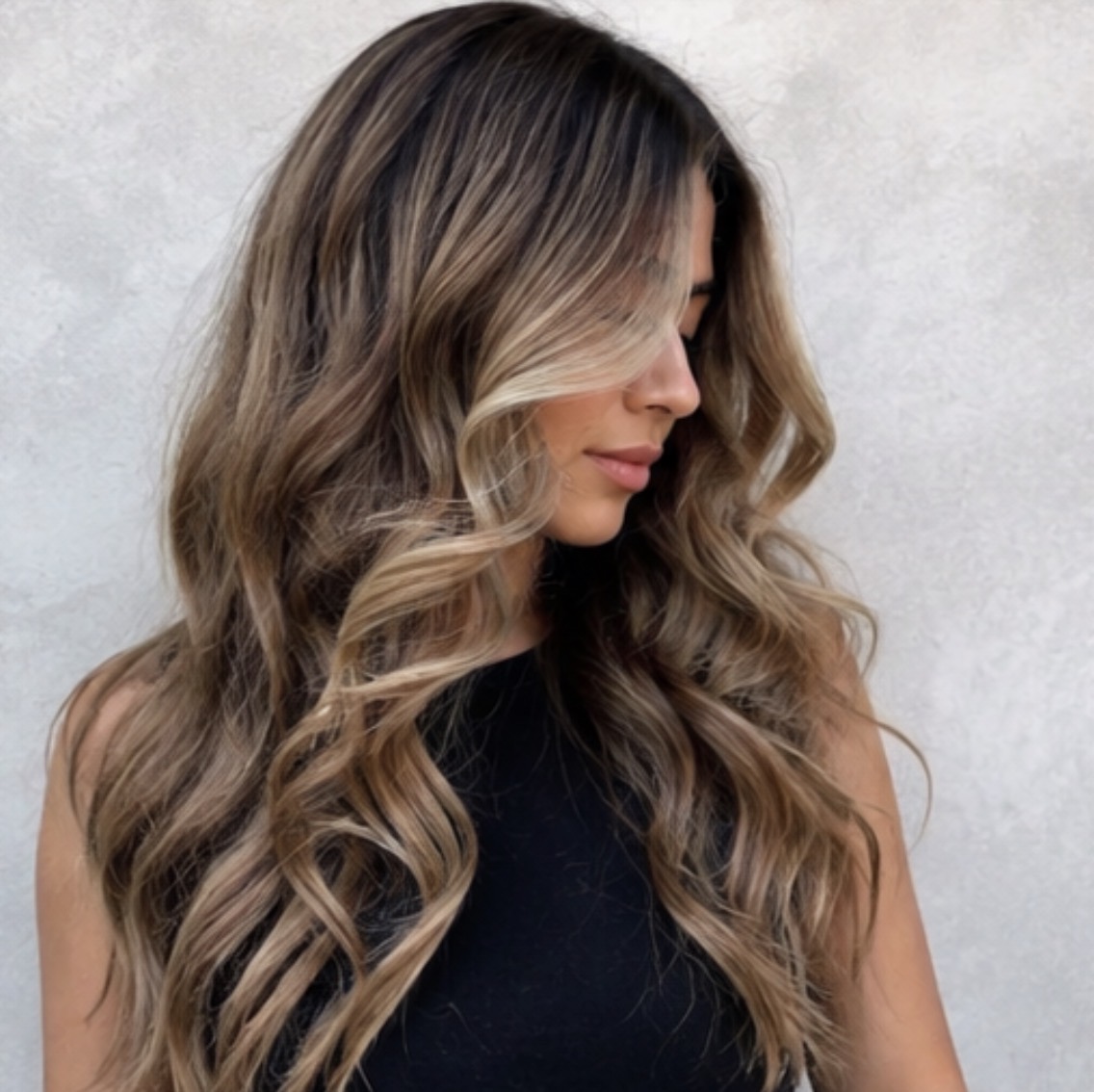 Blonde balayage with deep shadow root and glam waves