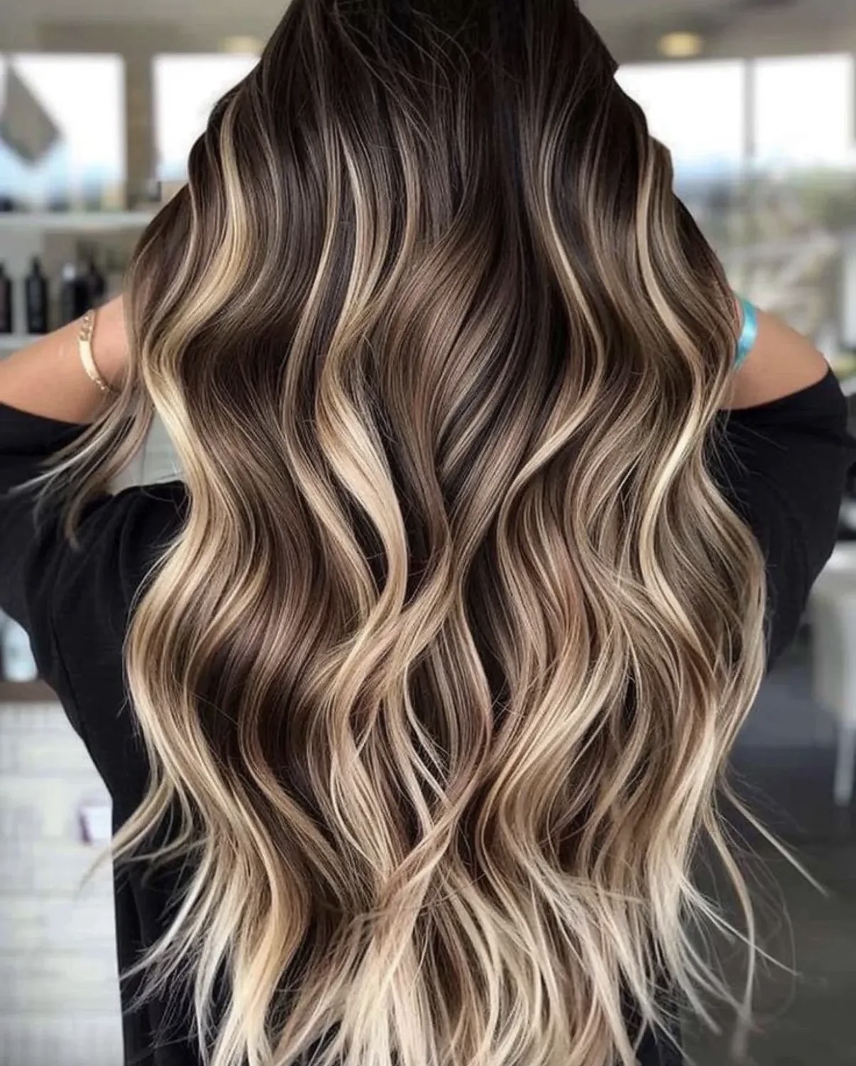 Blonde balayage with long flowing waves