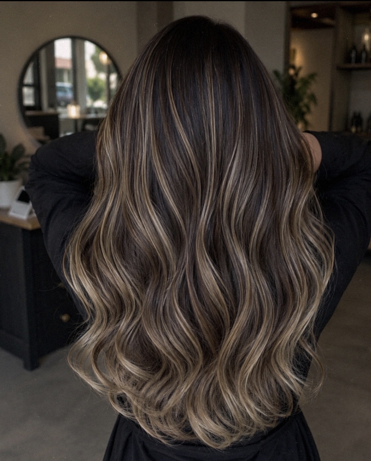Brunette balayage with warm caramel waves