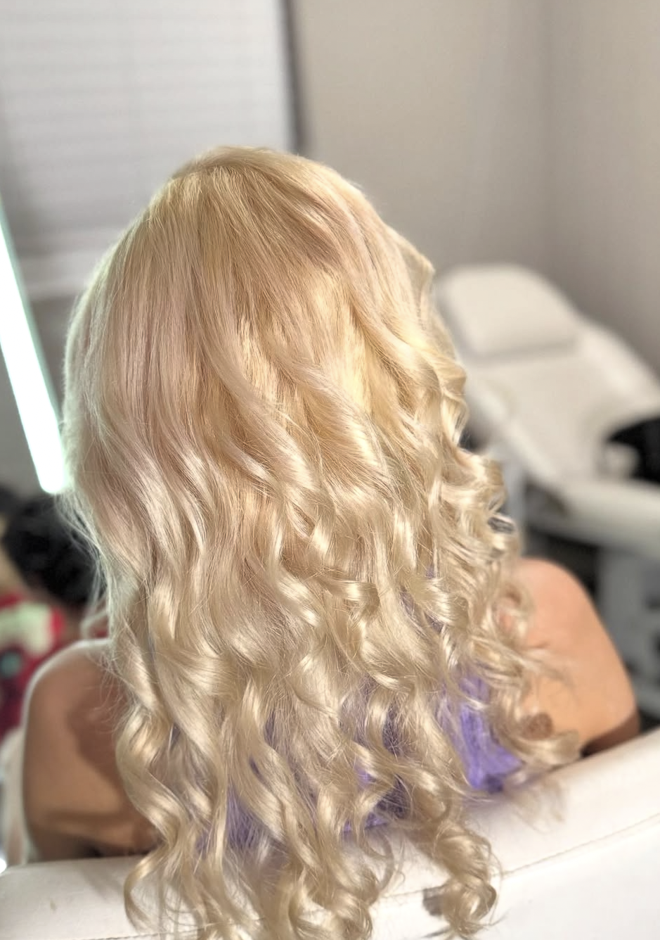 Long blonde hair with soft voluminous curls
